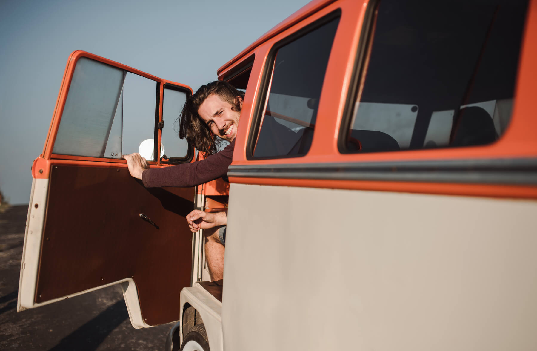 H2 18 28 a young man getting out of a car on a roadtrip thr GHELMKS