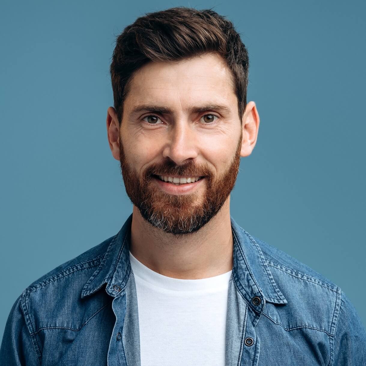 H2 18 2 portrait of cheerful handsome man in denim shirt s ZXG9M4P